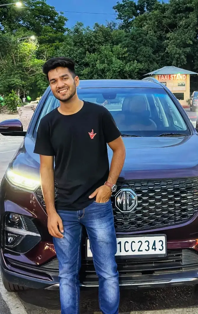 Pritish Bhatti smiling, front-facing in a black t-shirt