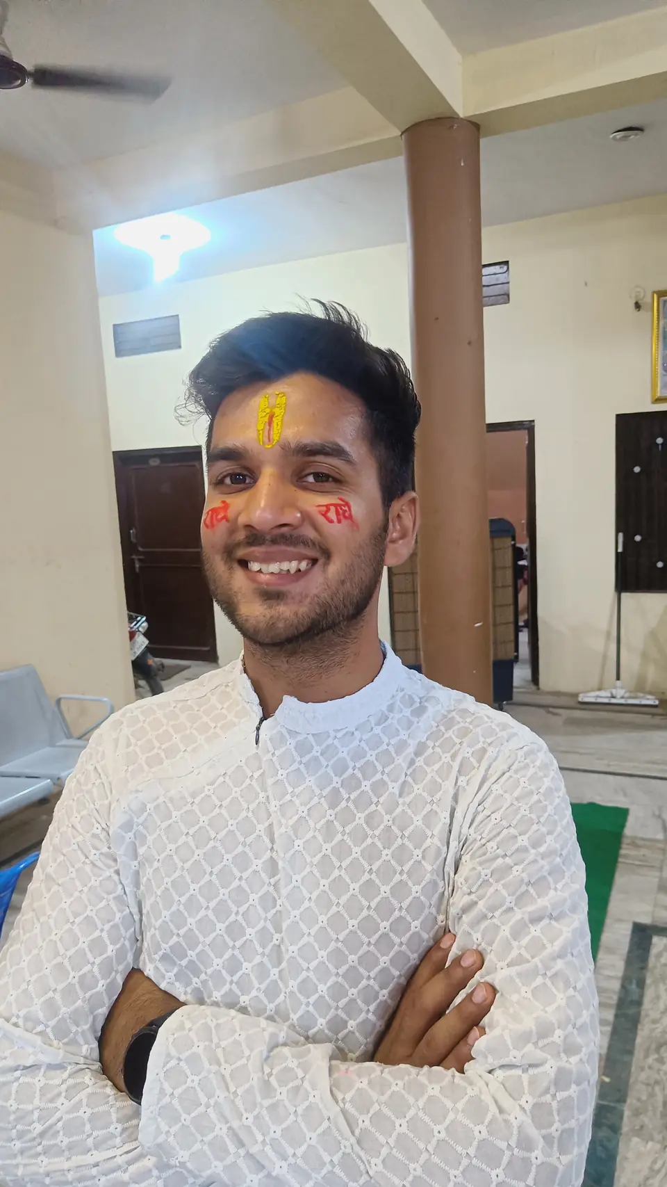 Pritish Bhatti smiling in traditional wear with a tikka on his forehead